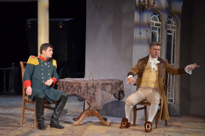 Спектакль начинается как читка пьесы: актеры в современных костюмах сидят на авансцене и зачитывают стихотворный текст из книги Грибоедова.